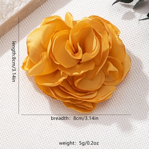Detailed view of yellow fabric rose brooch with size markings of 8x8cm and 5g weight