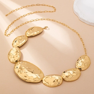 Irregular hammered metal geometric body chain for women in a stylish golden finish