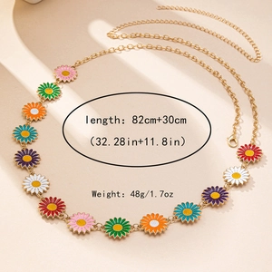 Detail of colorful enamel daisy charms on adjustable golden alloy body chain link