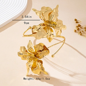Chunky gold oversized irregular flower arm cuffs with realistic metallic floral petals