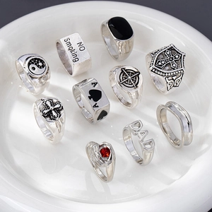 Macro view of vintage silver punk rings set featuring spade A and yin yang designs