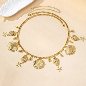 Detailed view of gold ocean charms with starfish and shells on a textured chain belt