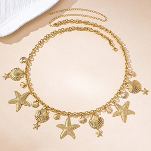 Detailed view of ocean-themed gold waist chain with seashell and starfish charms