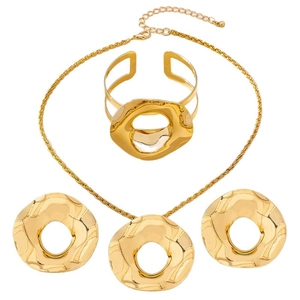 Golden irregular geometric jewelry set with necklace bracelet and earrings in hammered metal