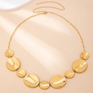 Detail of gold ocean-themed waist chain with lobster clasp and adjustable metal links