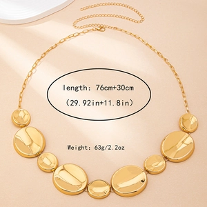 Detail of adjustable golden ocean waist chain with mirror-polished charms and 76+30cm length