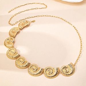 Close-up of golden sea shell chain with 8 textured spiral snail pendants and lobster clasp
