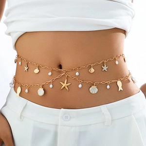Detail of double-layer gold waist chain with starfish, shell charms and pearls