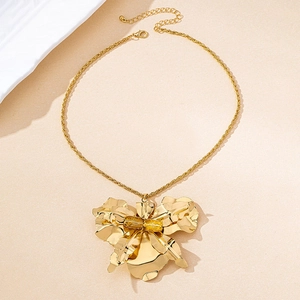 Detail of gold flower petal necklace with a twisted rope chain and adjustable clasp