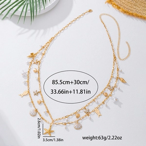 Detail showing dimensions of gold starfish and shell charms on beach waist chain