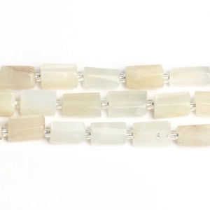 Detailed macro shot of rectangular white moonstone beads with clear spacer beads