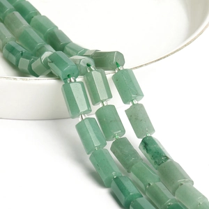 Detailed view of green aventurine hexagonal column beads with small silver spacers