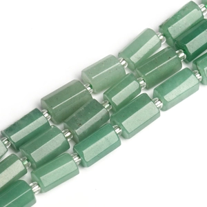 Macro shot of polished green natural stone cylindrical beads for DIY jewelry design