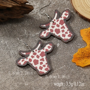 Cow print head dangle earrings in rustic style with measurement dimensions shown