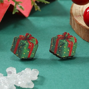 Pendientes de madera de caja de regalo de Navidad con lazo rojo y estrellas