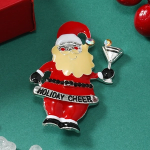 Macro shot of a Santa Claus brooch with Holiday Cheer banner and black rhinestones