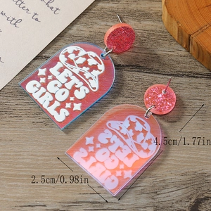Detail of pink acrylic Let's Go Girls earrings with cowboy hat design and size markers