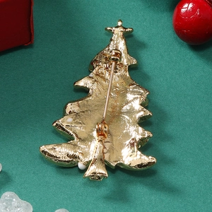Detailed back view of golden Christmas tree brooch with secure safety pin clasp