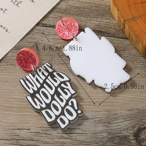 Detail of acrylic earring with pink glitter stud and What Would Dolly Do lettering