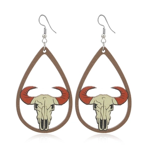 Bohemian teardrop wooden earrings featuring a bull skull design with red horns