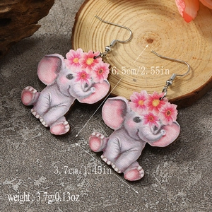 Detail of cute elephant wooden earrings featuring pink flower motifs and dimensions
