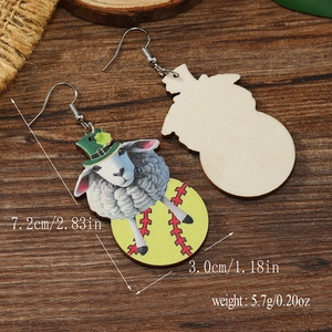 Close-up showing dimensions of wooden teardrop earrings with sheep and softball print