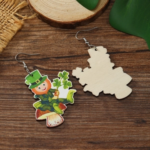 Detail of St. Patrick’s Day wooden earrings showing leprechaun print and natural texture