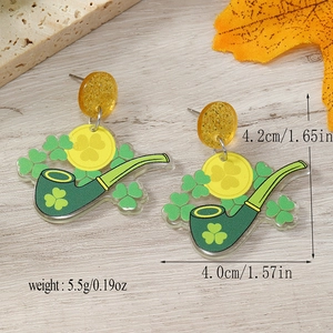 Detailed view of acrylic St. Patrick's Day earrings with green clover and pipe patterns
