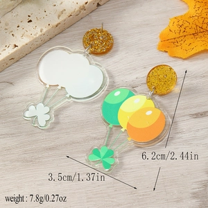 Detail view of Saint Patrick's Day acrylic balloon earrings with dimensions and weight