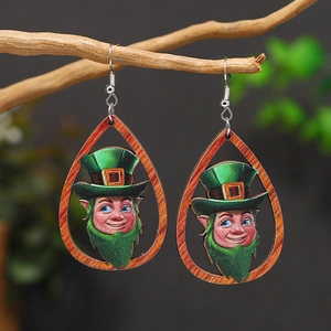 Detail view of St. Patrick's Day wooden teardrop earrings with leprechaun character