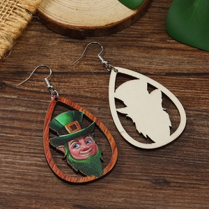 Teardrop wood earrings featuring leprechaun print and hollow cutout for St. Patrick's Day