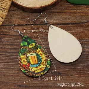 Detailed view of teardrop wood earrings with St. Patrick's beer pattern and size specs