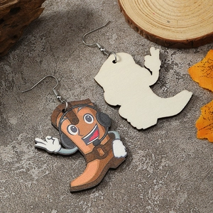 Detail showing the colorful printed cartoon boot design and natural wood back of the earrings