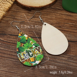 Detail of wooden Lucky teardrop earrings with St. Patrick's Day clover and beer mug motifs