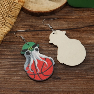 Detail of wooden octopus basketball earrings with St. Patrick's Day green hat theme