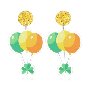 Detailed macro view of St. Patrick's Day clover and balloon earrings in clear acrylic