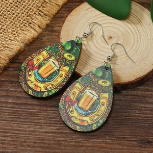 Detail showing teardrop wooden earrings with St. Patrick's Day horseshoe and clover prints