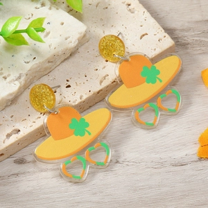Saint Patrick's Day acrylic earrings with shamrock hat and heart sunglasses design