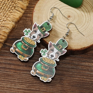 Detail of St. Patrick's Day wooden earrings featuring a dog on a gold coin pot