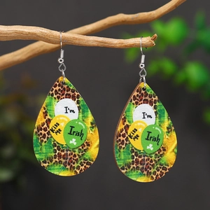 Saint Patrick's Day leopard teardrop earrings with clover and balloon print on wood