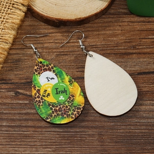 Detail of teardrop wood earrings with St. Patrick's Day leopard print and Irish balloon designs