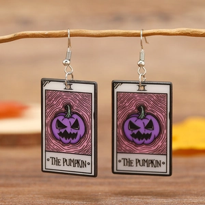 Gothic acrylic tarot card earrings featuring devil pumpkin design on a tree branch