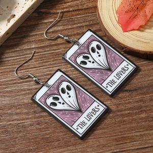 Detail of The Lovers tarot card acrylic earrings with purple ghosts in heart shape