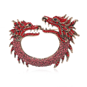 Golden dragon brooch with red sparkling rhinestones in a circular twin-head design