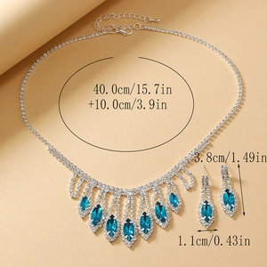 Detailed view of silver crystal bridal jewelry set with navy blue marquise gemstones