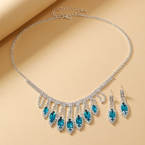 Detailed macro view of royal blue marquise crystal bridal jewelry set with silver rhinestones