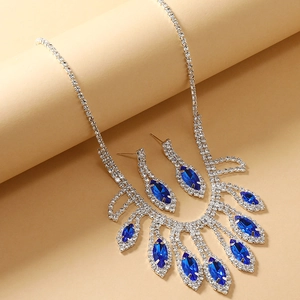 Elegant bridal jewelry set with blue teardrop crystals and silver rhinestone tassels