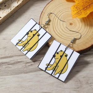 Detail view of acrylic square drop earrings with cute yellow animal cartoon pattern