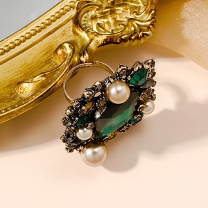 Vintage French palace style gold ring with a large green gemstone and white pearls