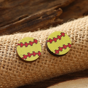 Handcrafted round wooden baseball earrings with red stitching on a natural wood surface